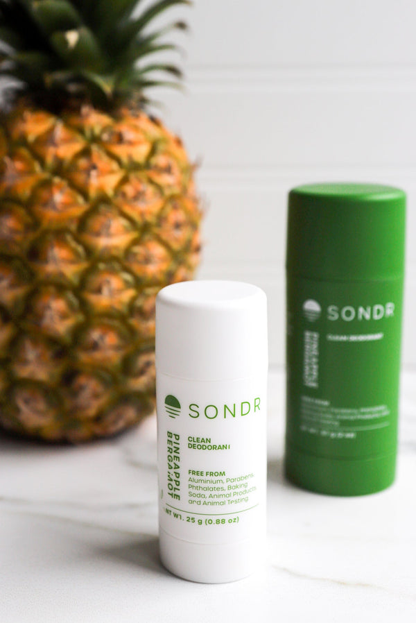 SONDR pineapple bergamot deodorants in travel and full size